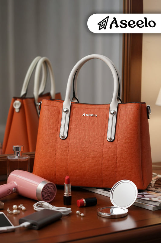 Jade Structured Handbag by Aseelo in orange